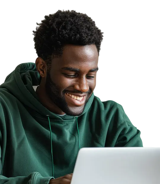 Smiling man in a green hoodie using a white laptop.